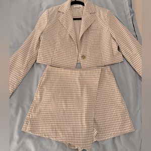 Women’s 2 Piece Matching Blazer & Skort Set.